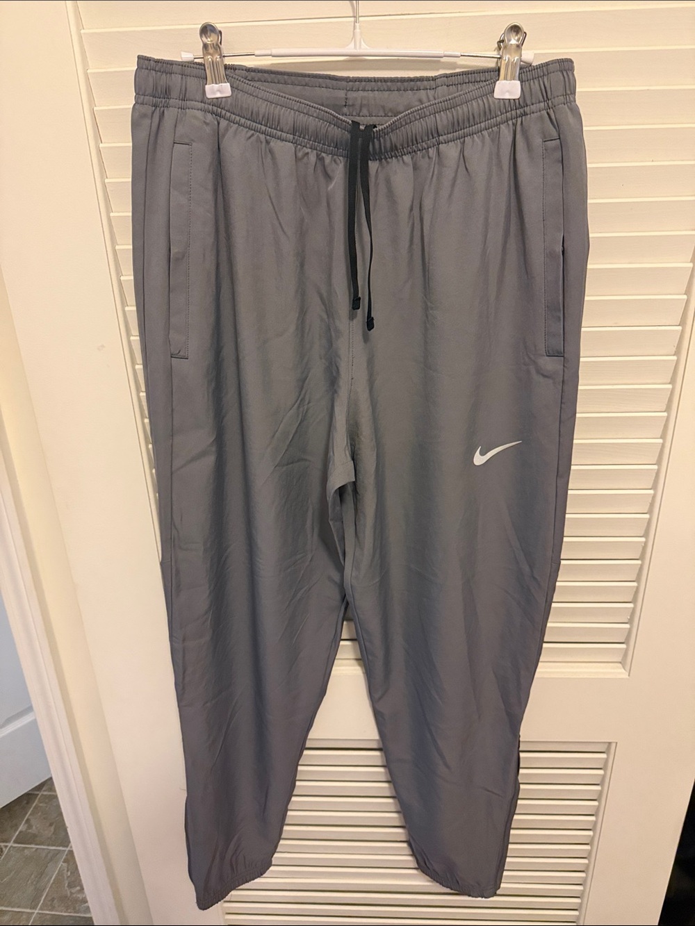 Nike Gray Athletic Track Pants with White Swoosh